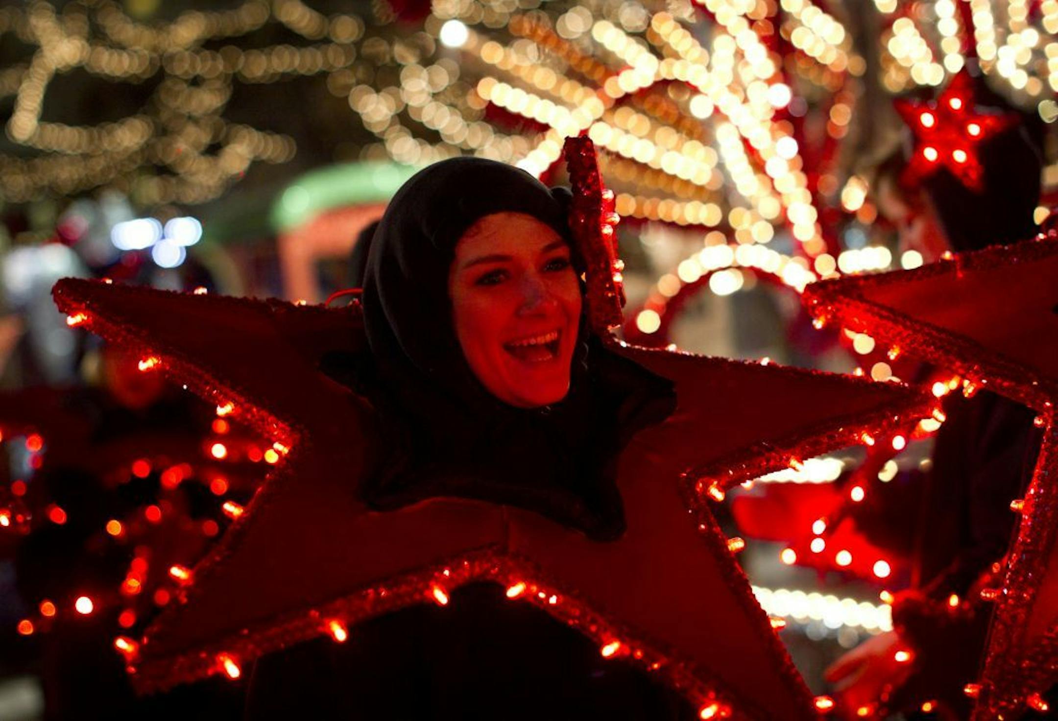 Sarah Burgess of Minneapolis dressed as a star as she volunteered in the 20th annual Target Holidazzle Parade with her colleagues from St. David's Center in 2011.
