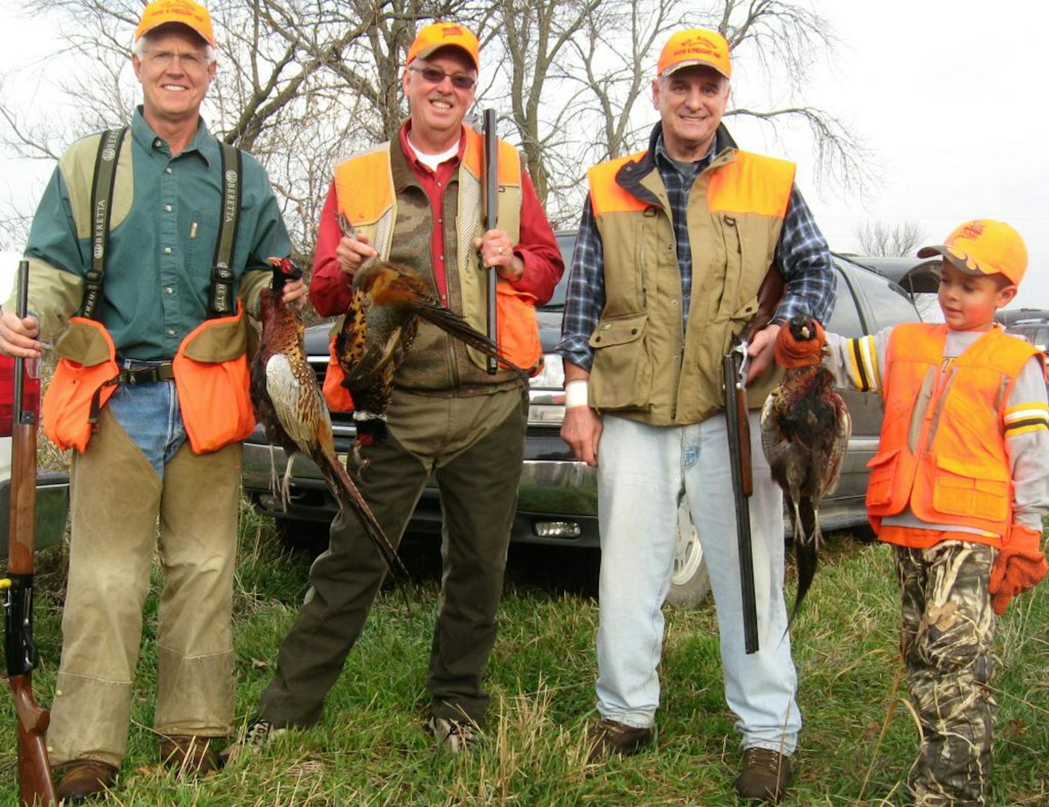 Gov. Mark Dayton, with hunting companions, (left to right) Dennis Larson of Montevideo, Dave Nomsen of Garfield, Minn, and Arjun Chaudhary, after a successful hunt last October in western Minnesota. Photo by Angela Steinbach