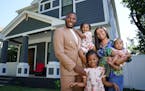 Jovonta Patton and his wife, Symone, are pictured with daughters Ella, 5, Zoey, 3, and baby Cali in front of the new home they purchased a few months 