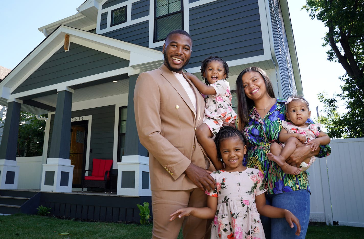 Jovonta Patton and his wife, Symone, are pictured with daughters Ella, 5, Zoey, 3, and baby Cali in front of the new home they purchased a few months ago in Minneapolis.