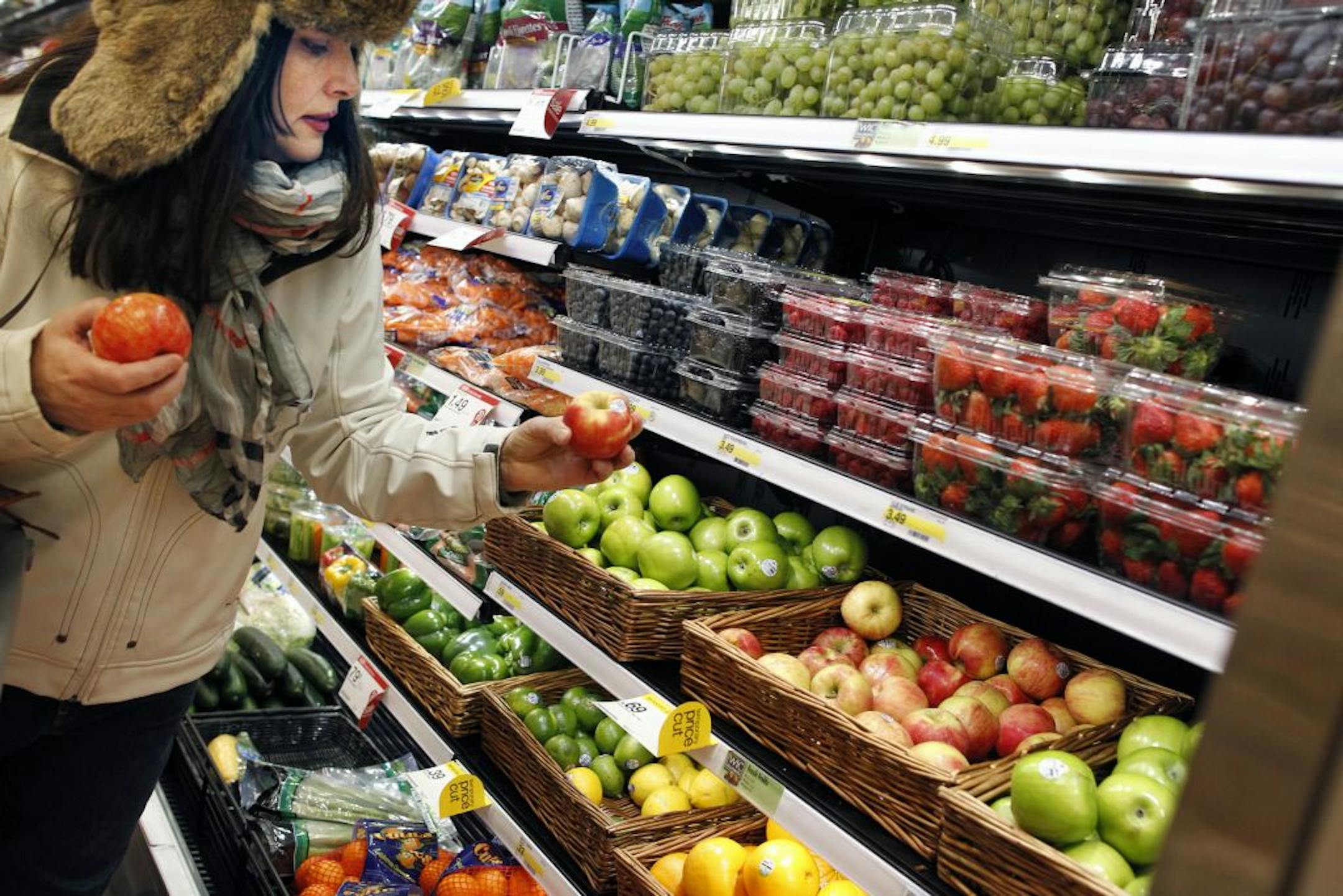 Maura Schnorbach checked out some apples in the produce aisle of the Target store at Hwy. 100 and 36th Street in St. Louis Park. "It's fresh. It's easy to find things," the Edina resident says. Target increased sales in part because "P-Fresh" groceries have been added to many stores.