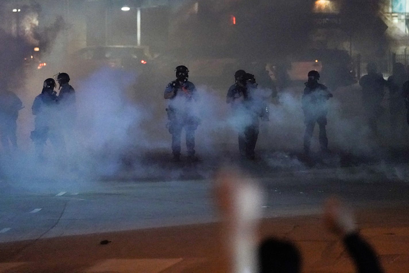 About a hundred largely peaceful protesters were met with less-lethal ammunition from police at Lake Street and Hiawatha Avenue on Saturday.