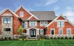 Home plan: A combination of shingle and stone delivers grand curb appeal to this Craftsman design.