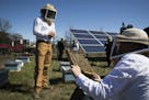 Travis and Chiara Bolton of Bolton Bees, gave a tour of a bee hive placed in the pollinator friendly solar panel field to media and guests at Connexus