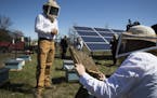 Travis and Chiara Bolton of Bolton Bees, gave a tour of a bee hive placed in the pollinator friendly solar panel field to media and guests at Connexus