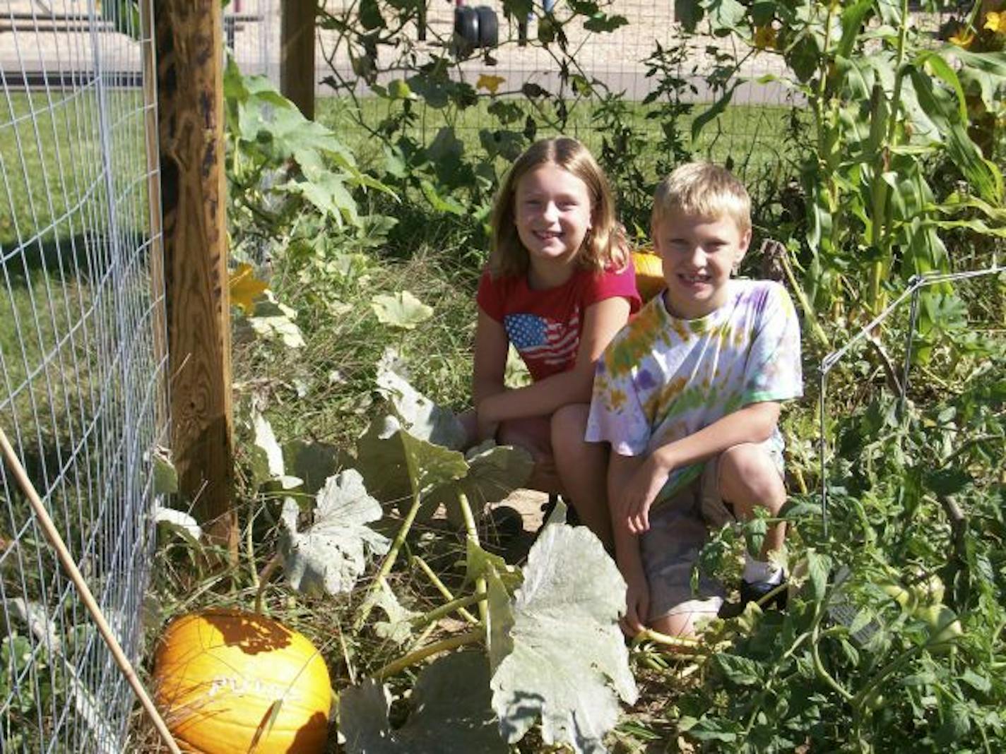 Kids tend Salem Hills Community Garden plots