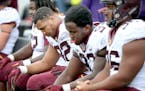 Minnesota's defensive lineman Robert Ndondo-Lay sat on the sideline during the last few minutes of the game as the Northwestern Wildcats defeated Minn