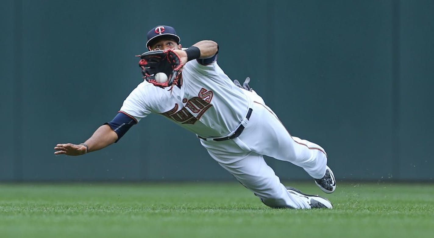 Twins center fielder Aaron Hicks caught a fly ball hit by the Red Sox's Daniel Nava during the second inning Monday.