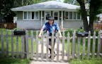 Gypsy Rogers outside the duplex he owns Tuesday, June 9, 2015, in Hopkins, MN. Rogers believes the city is guilty of extortion and out of principle he