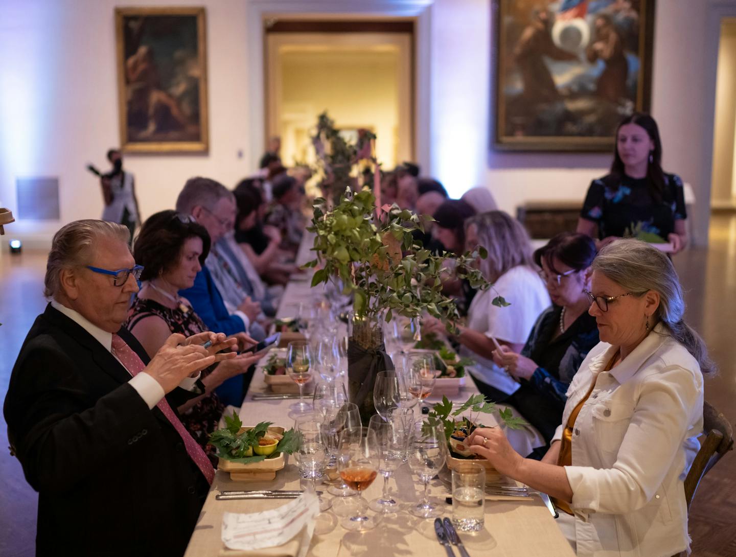 Lee Kitzenberg and Shelly Franz photographed and admired their second course during the first of several masterpiece dining experiences at the Minneapolis Institute of Art on Wednesday, July 6, 2022. The institute is launching after-hours art and dining experiences in the museum's galleries. The first one, "Kaiseki, a Story of Van Gogh and Japan in 1880," blends traditional Japanese and European culinary styles in a menu created by chef Shigeyuki Furukawa (of Kaiseki Furukawa), chef Jamie Malone and sommelier Bill Summerville. Guests also got a guided tour of the exhibits "Dressed by Nature: Textiles of Japan" and "Van Gogh and the Olive Groves" by museum curators. ] RENEE JONES SCHNEIDER • renee.jones@startribune.com