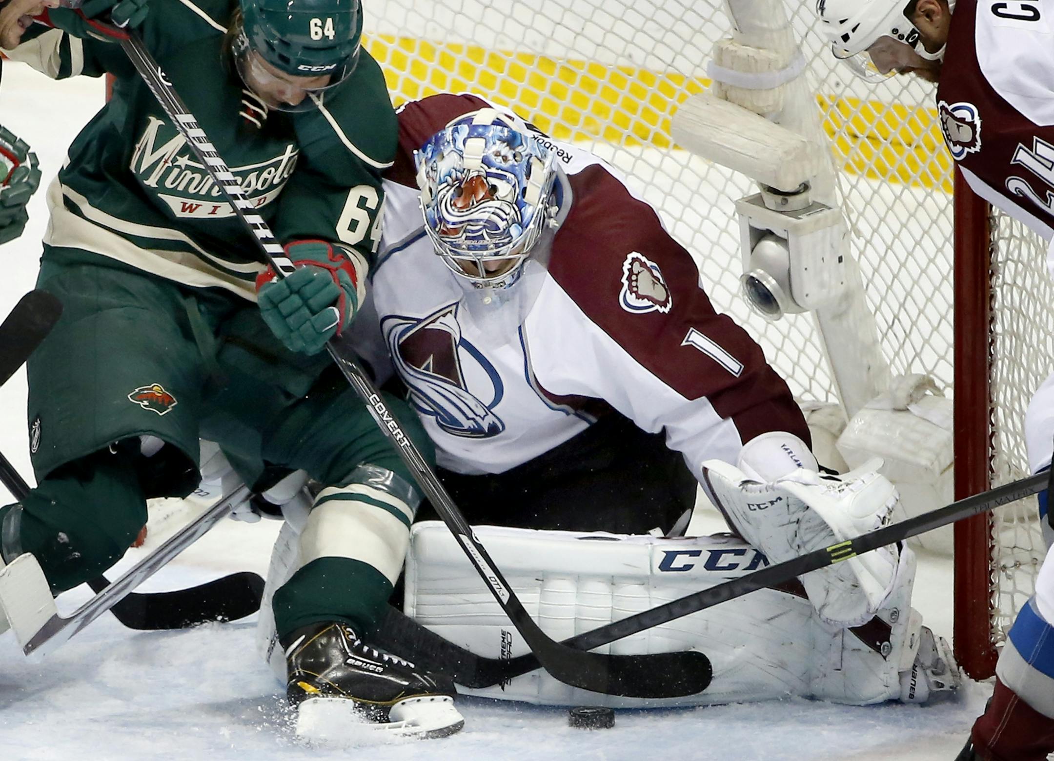 Mikael Granlund, left, got nowhere batting a Wild scoring attempt into Semyon Varlamov’s pads. So in overtime, he got more creative.