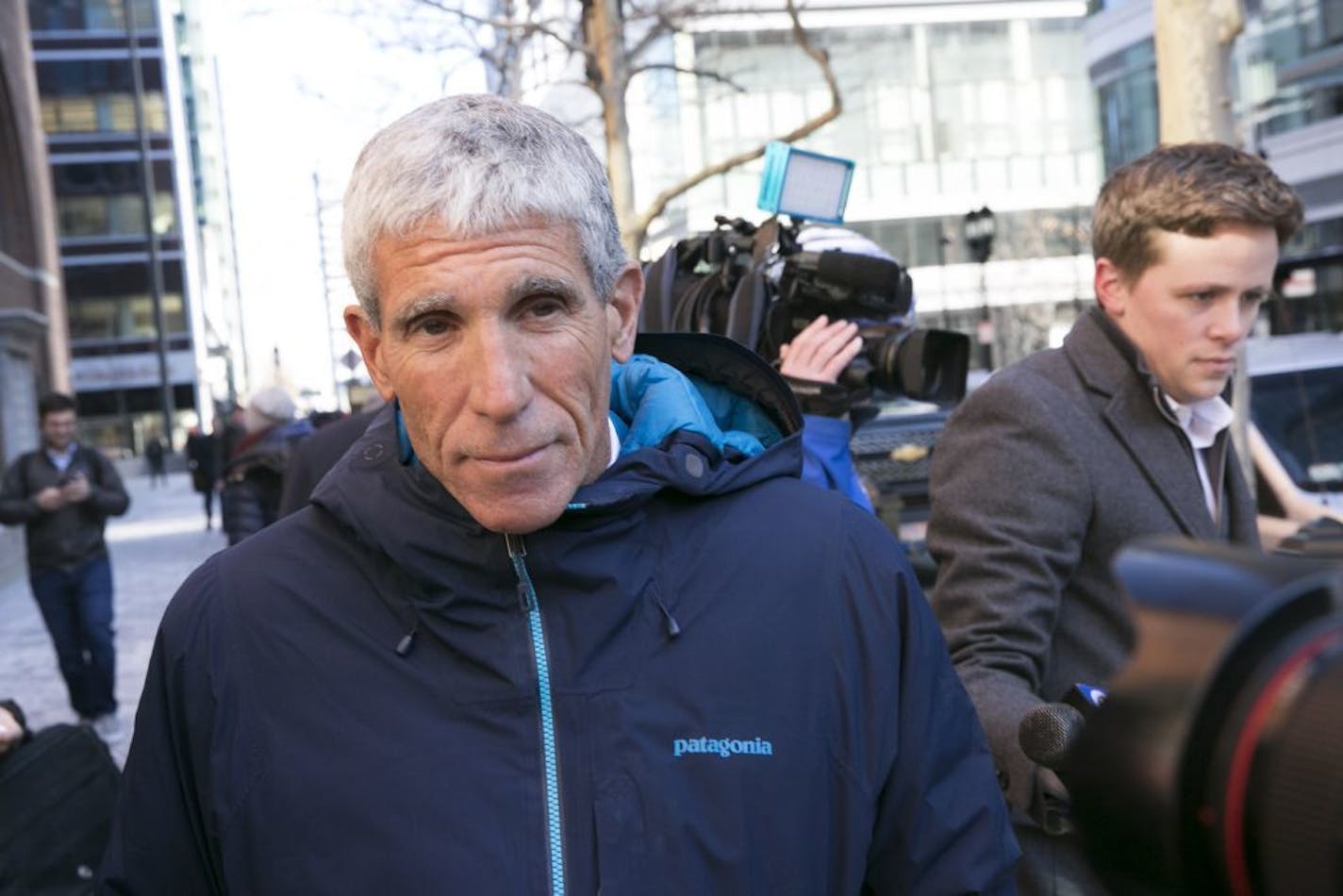 William Singer, the founder of The Edge College & Career Network, leaves federal court after pleading guilty to charges related to college admission schemes, in Boston, March 12, 2019. Dozens of wealthy parents paid millions of dollars in bribes to secure the admission of their children into elite universities, prosecutors said in court documents filed Tuesday.