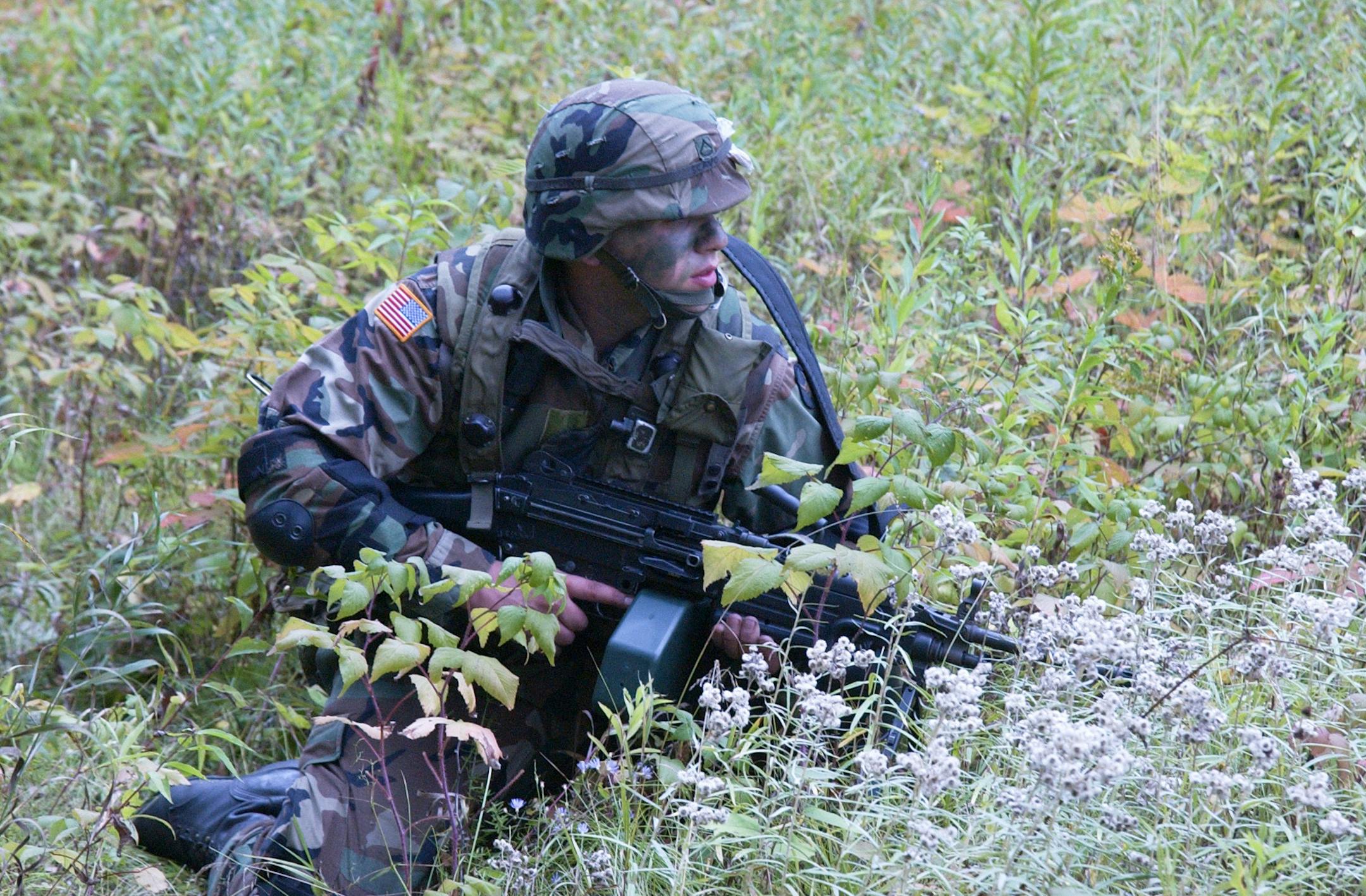 PHOTO TAKEN BY Charles�Farrow. This is a Minnesota Army National Guard soldier from the Mankato based 2-135 INF training on the infantry assault course at Camp Ripley, September, 2003 in preparation for the unit�s 2004 deployment to Kosovo where they provided security and stability as part of the peacekeeping operation.