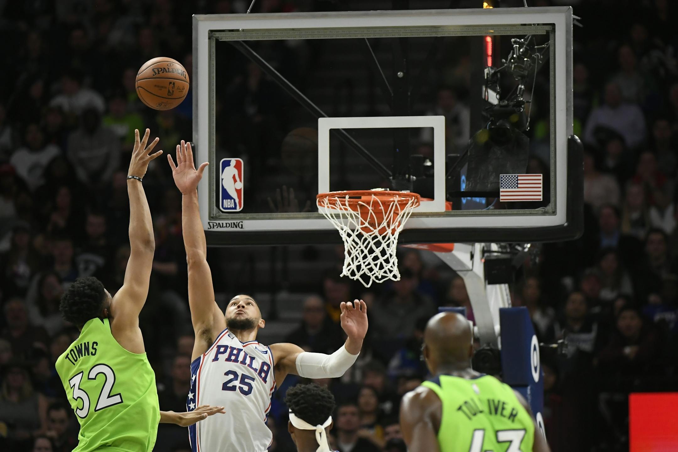 Minnesota Timberwolves center Karl-Anthony Towns (32) hit a basket over Philadelphia 76ers guard Ben Simmons (25) in the second half.