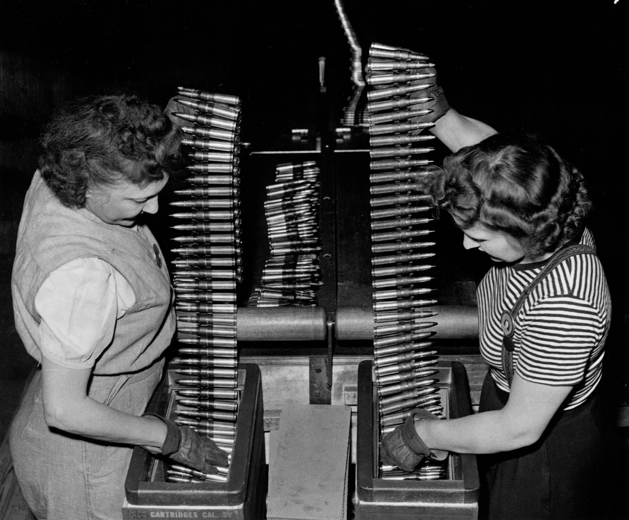1940s: Twin Cities Ordnance Plant workers packing cartridge belts made at the arms factory.