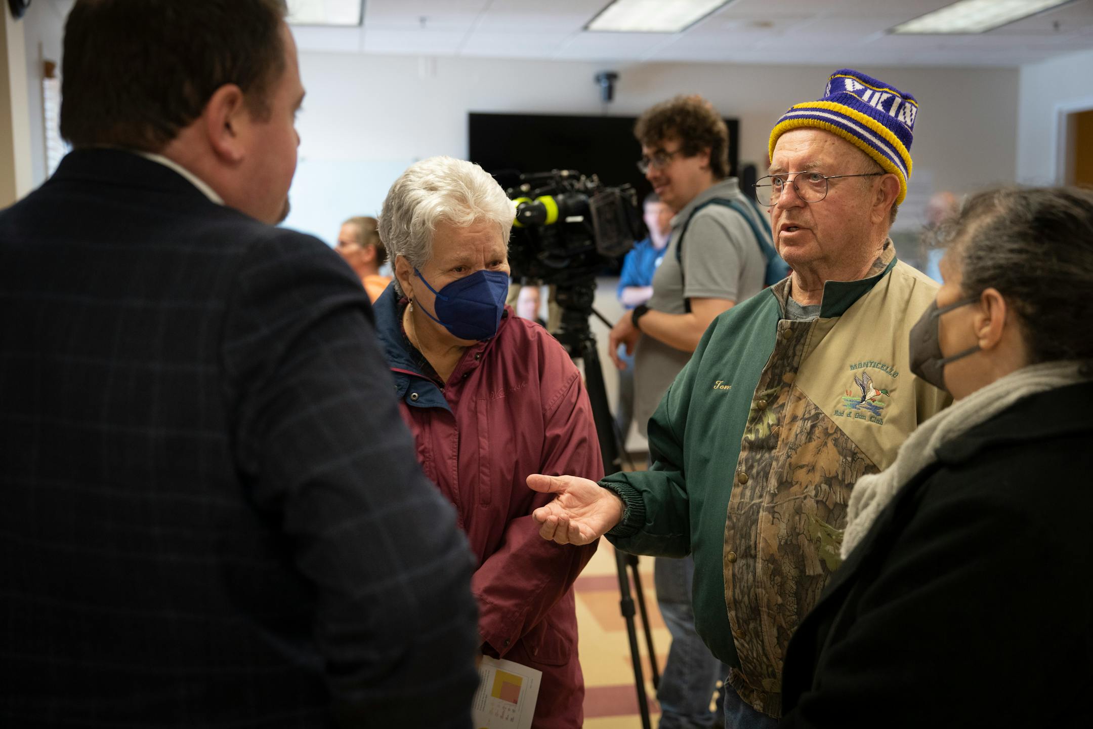 Tom Prom, along with his neighbors Sharon Mueller, left, and Christy Petit, right, ask questions to Xcel Energy regional vice president John Marshall during a community meeting. The three live a quarter of a mile form the nuclear power plant that has has two reported leaks. They have lived there before the plant ever existed.