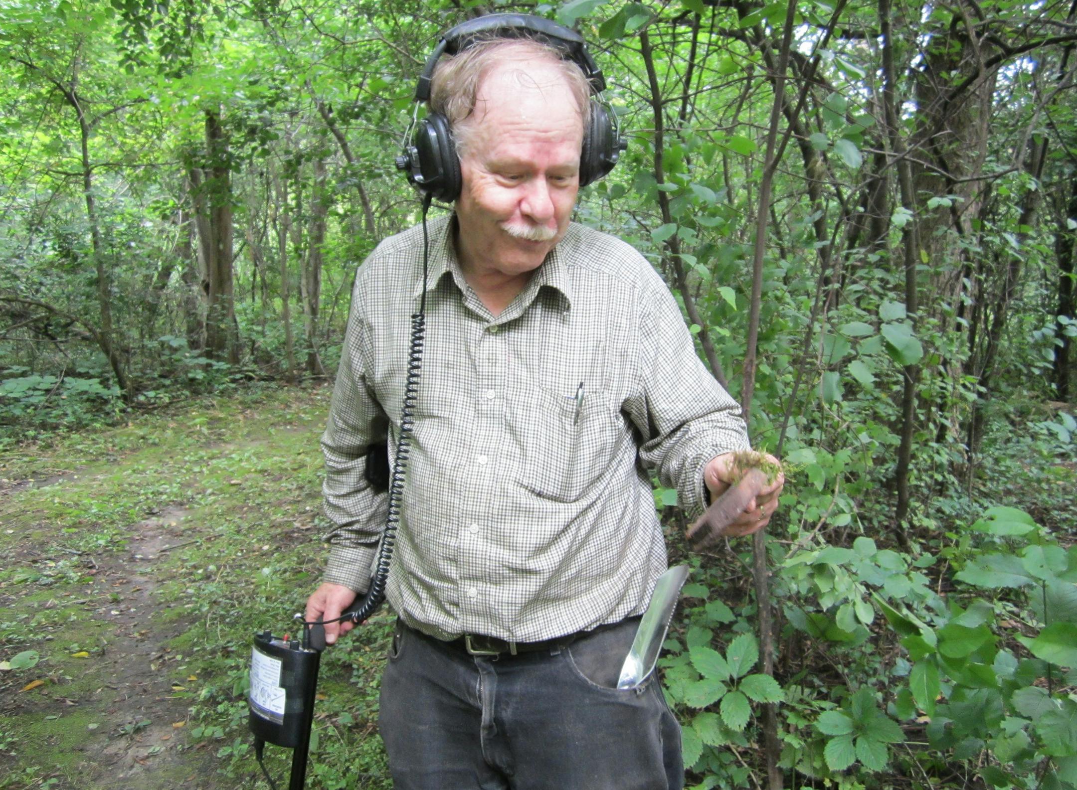 Richard Lauhead held a part of a tin can he found while looking for artifacts with his detector.