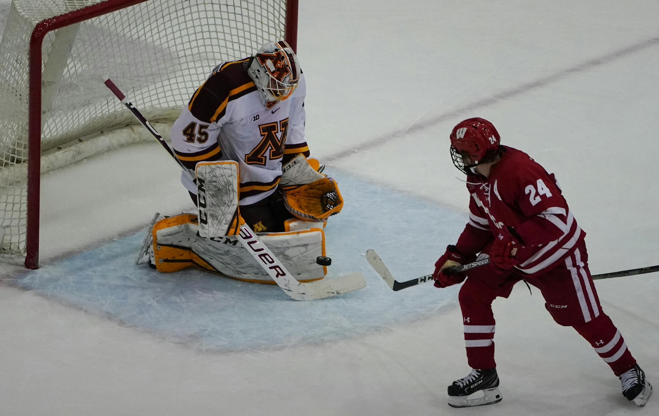 Minnesota goaltender Jack Lafontaine (45) made a save on Wisconsin forward Sean Dhooghe (24) in the second period. ] Shari L. Gross • shari.gross@startribune.com University of Minnesota men's hockey hosted Wisconsin at Mariucci Arena in Minneapolis, Minn. on Saturday, Nov. 23, 2019.