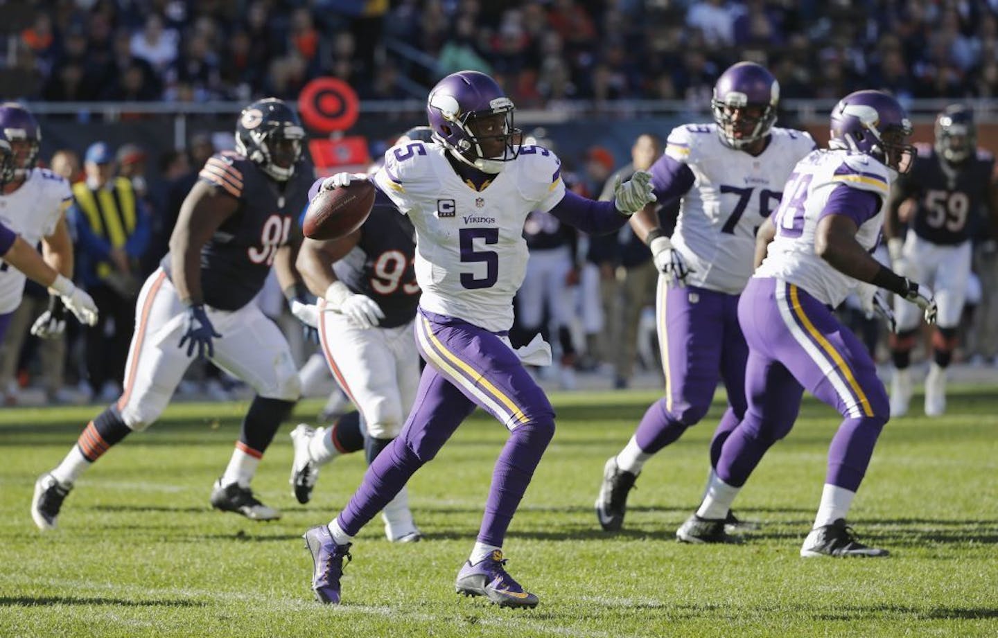 Minnesota Vikings quarterback Teddy Bridgewater (5) throws a pass during the second half of an NFL football game against the Chicago Bears, Sunday, Nov. 1, 2015, in Chicago.