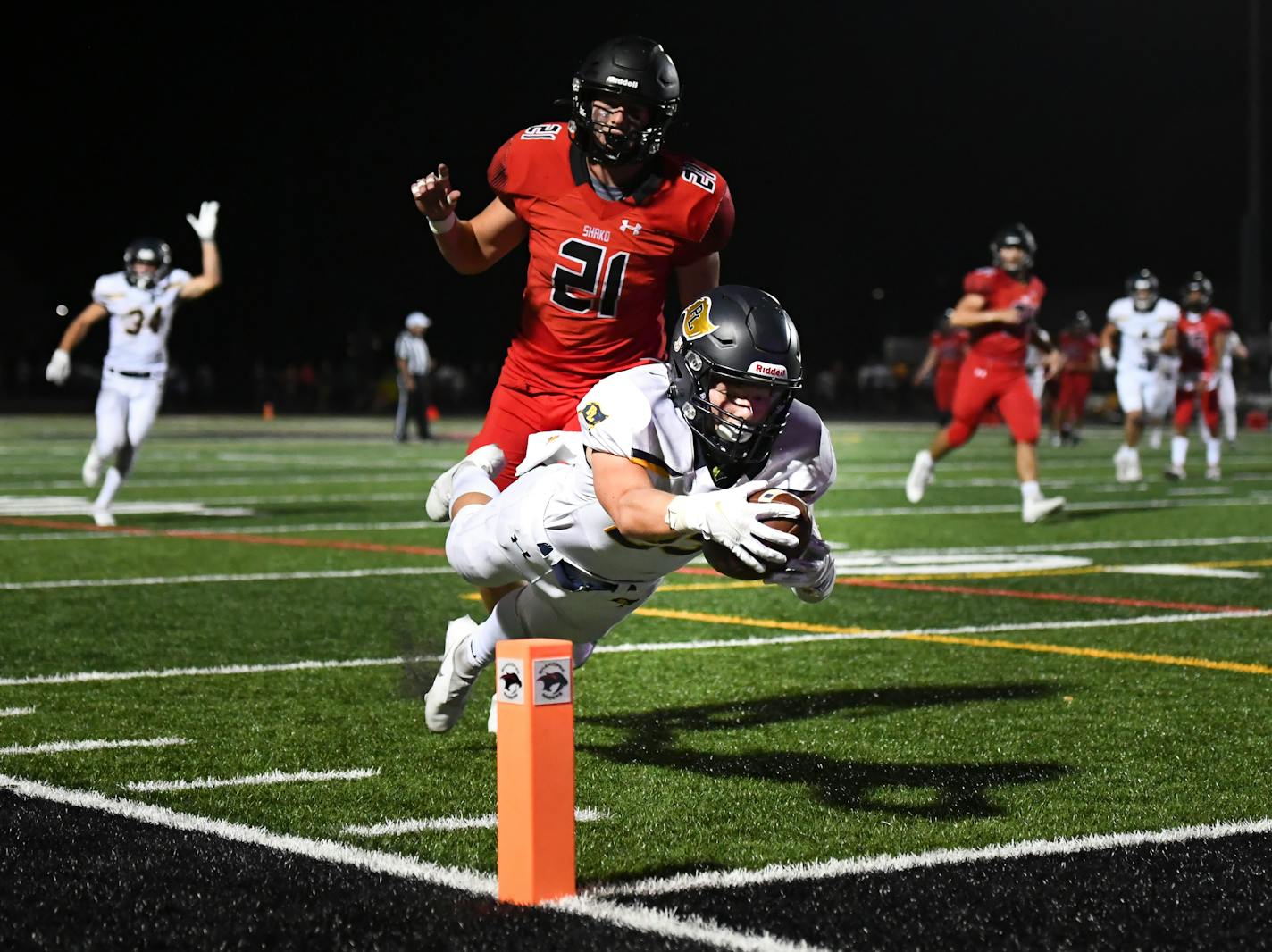 Prior Lake wide receiver Joey Krouse (23) leapt for a touchdown after a reception as he was trailed by Shakopee linebacker Tyrus Laden (21) in the third quarter. ] AARON LAVINSKY • aaron.lavinsky@startribune.com