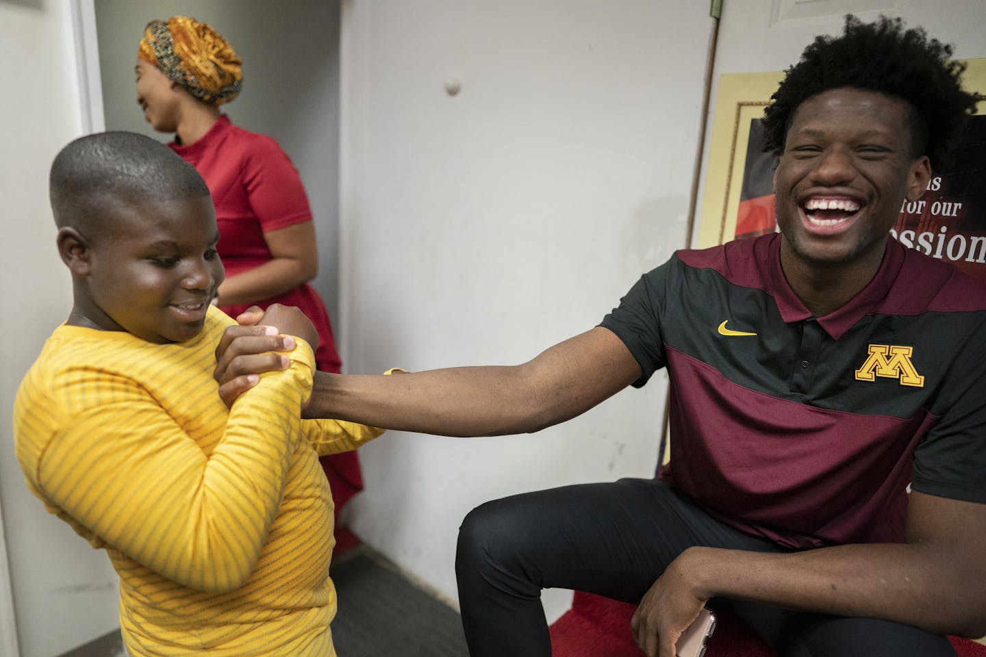 Attending his hometown university affords Gophers basketball player Daniel Oturu to the friendly giant and a role model for children at Mountain of Fire and Miracles church in St. Paul.