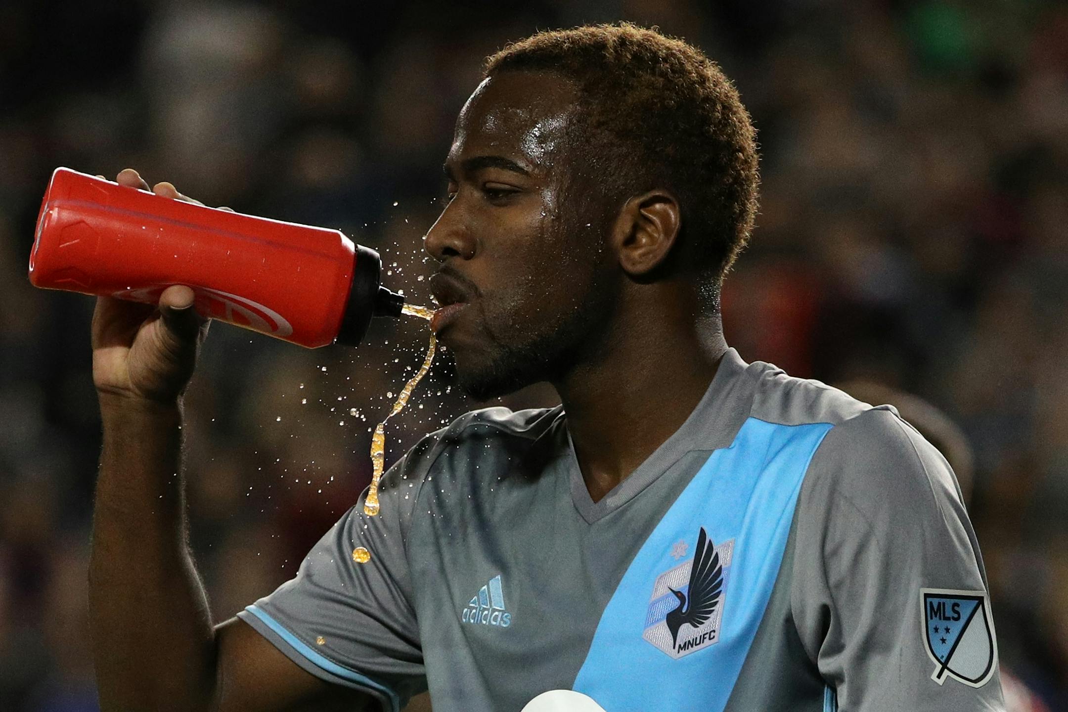 Minnesota United midfielder Kevin Molino (18) took a drink in the second half.