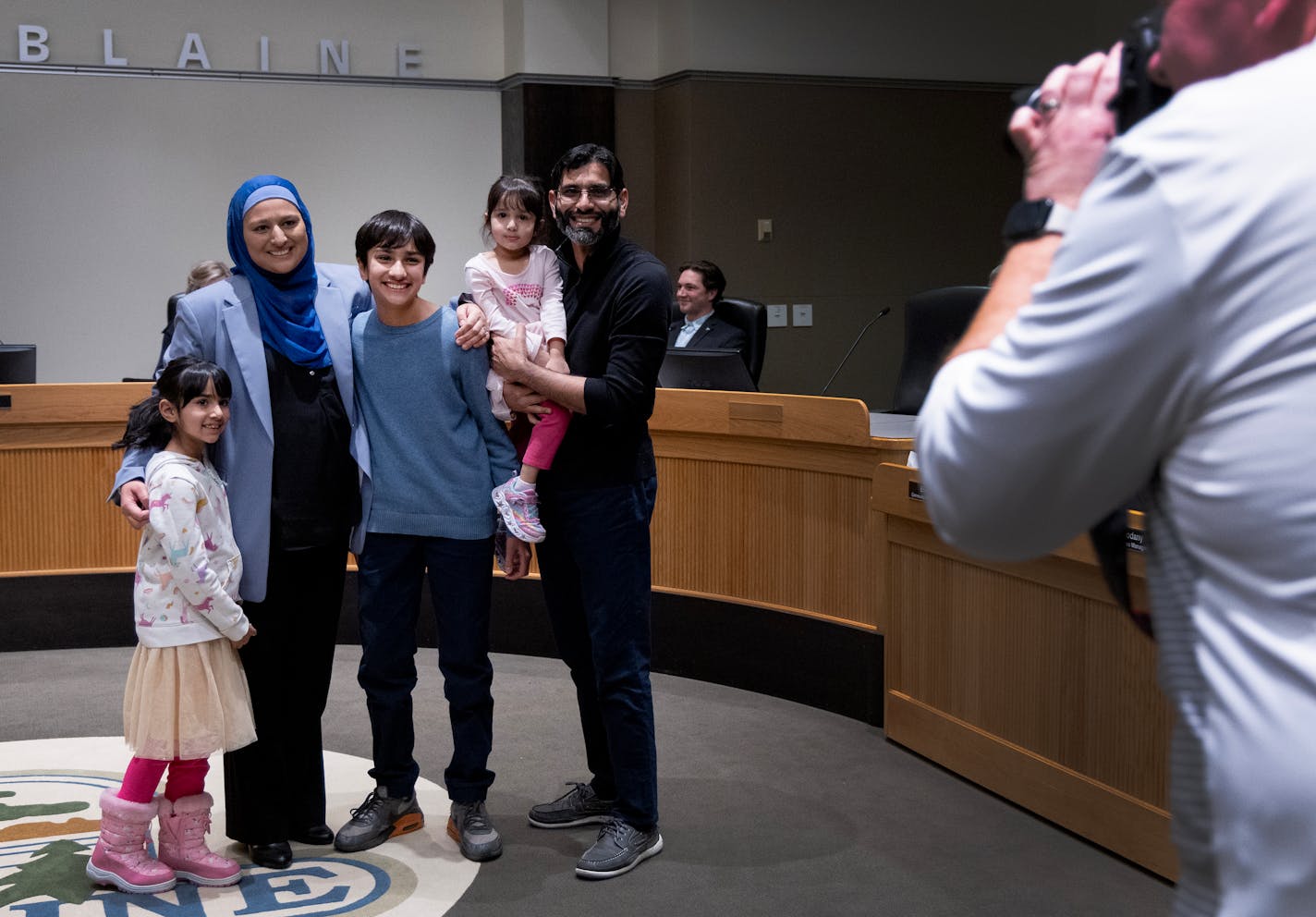 Lori Saroya poses for a photo with family after being sworn in as the Ward 1 City Council Member Wednesday, January 4, 2023, in Blaine, Minn. ] CARLOS GONZALEZ • carlos.gonzalez@startribune.com.