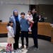 Lori Saroya poses for a photo with family after being sworn in as the Ward 1 City Council Member Wednesday, January 4, 2023, in Blaine, Minn. ] CARLOS