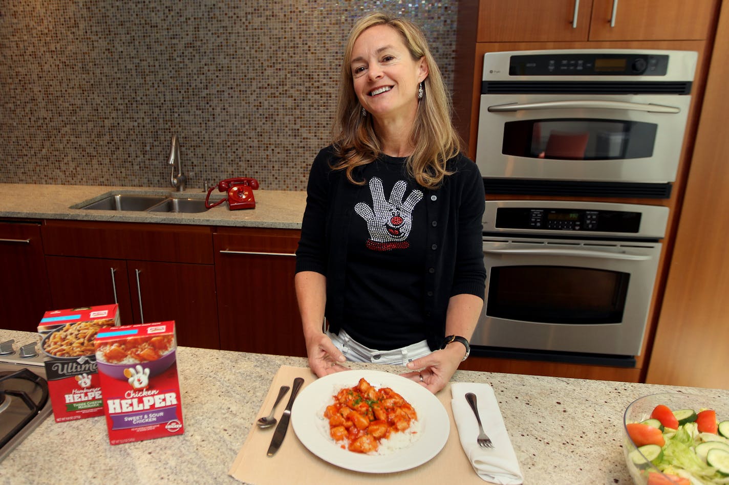 Katy Dickson, head of General Mills dinners division, poses for a portrait with the rebranded line of Hamburger Helper meals at the General Mills offices in Golden Valley, Minn., on Tuesday, June 25, 2013. ] (ANNA REED/STAR TRIBUNE) anna.reed@startribune.com (cq)