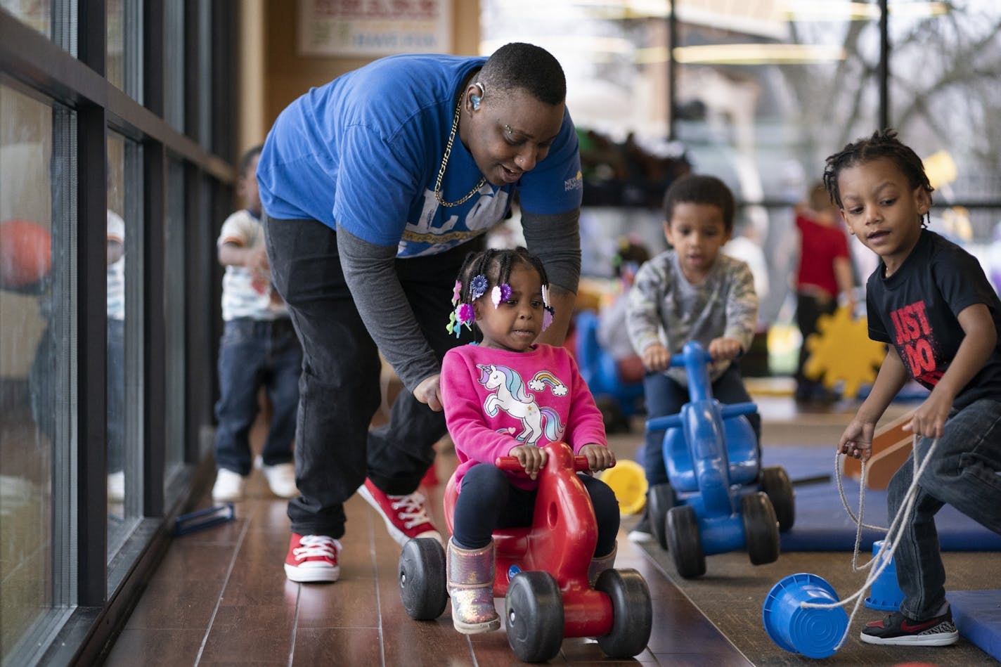 Tynise Underwood pushed Kamiyah Henry a preschooler on a scoter at New Horizon Academy childcare center .