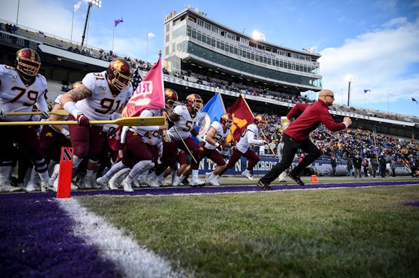 Minnesota Gophers head coach P.J. Fleck led his team onto the field before Saturday's game against the Northwestern Wildcats.