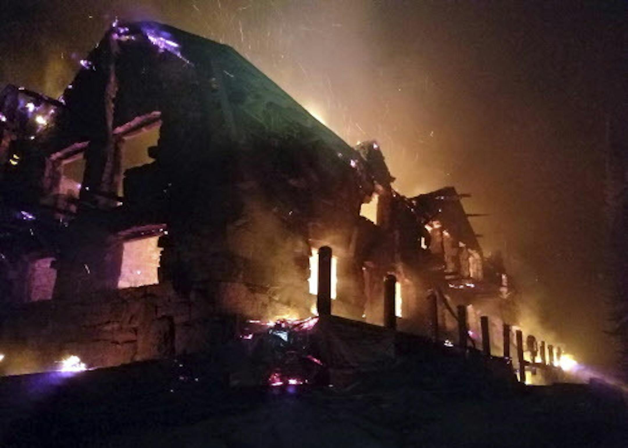This Thursday, Aug. 31, 2017, image from video provided by the Hutton Incident Team shows the historic main Sperry Chalet building engulfed in flames in Glacier National Park, Mont. Glacier National Park's historic Sperry Chalet was lost to the Sprague Fire overnight. (Hutton IncidentTeam via AP)