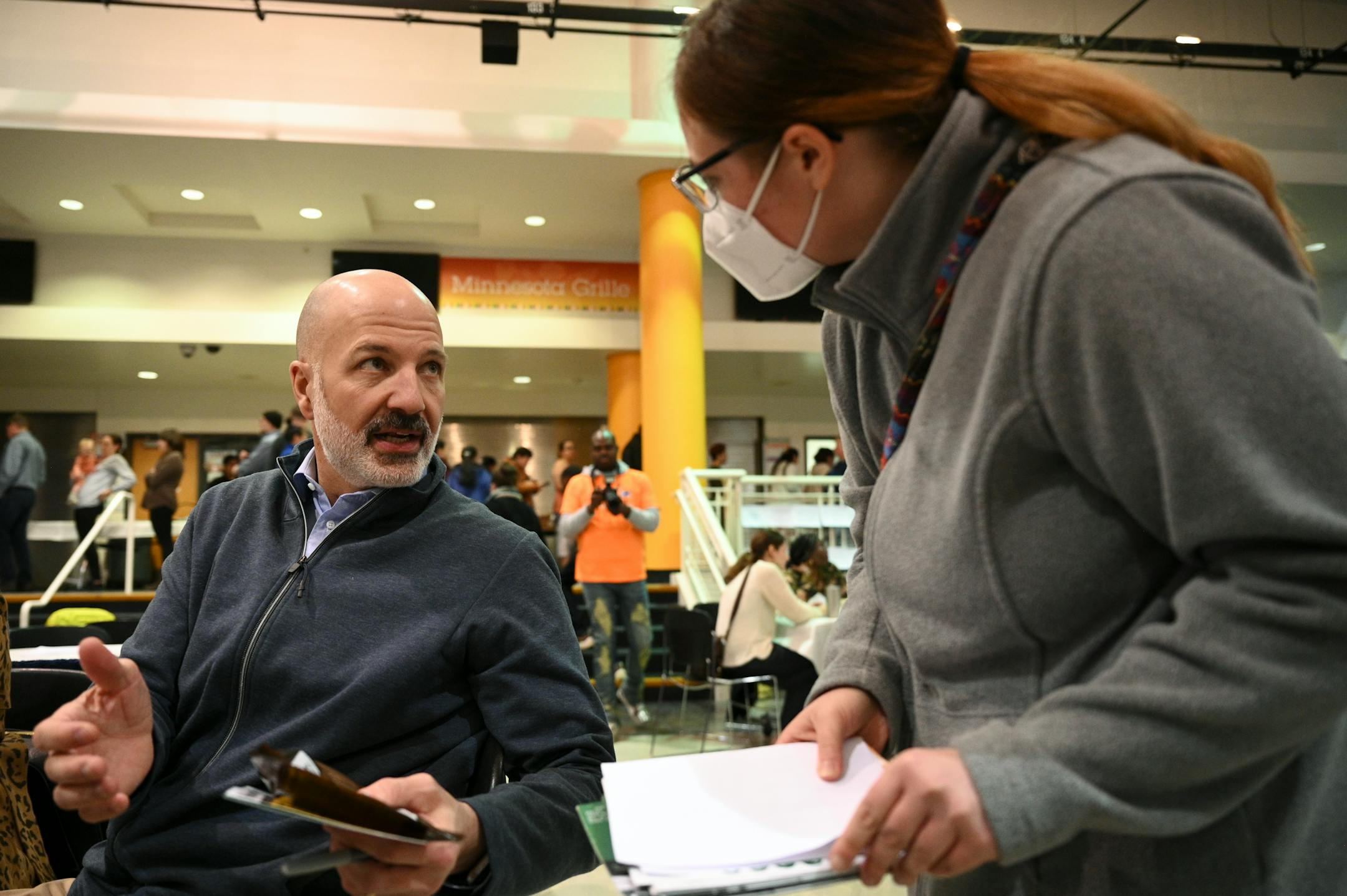 St. Paul School Superintendent Dr. Joe Gothard speaks with Meghan Thompson, a volunteer with the Steve Rummler Hope Network. Thompson was advocating for a narcotic safety program in schools which includes Narcan training.