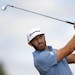 Dustin Johnson tees off on the fourth hole during the first round of the 3M Open golf tournament in Blaine, Minn., Thursday, July 23, 2020.