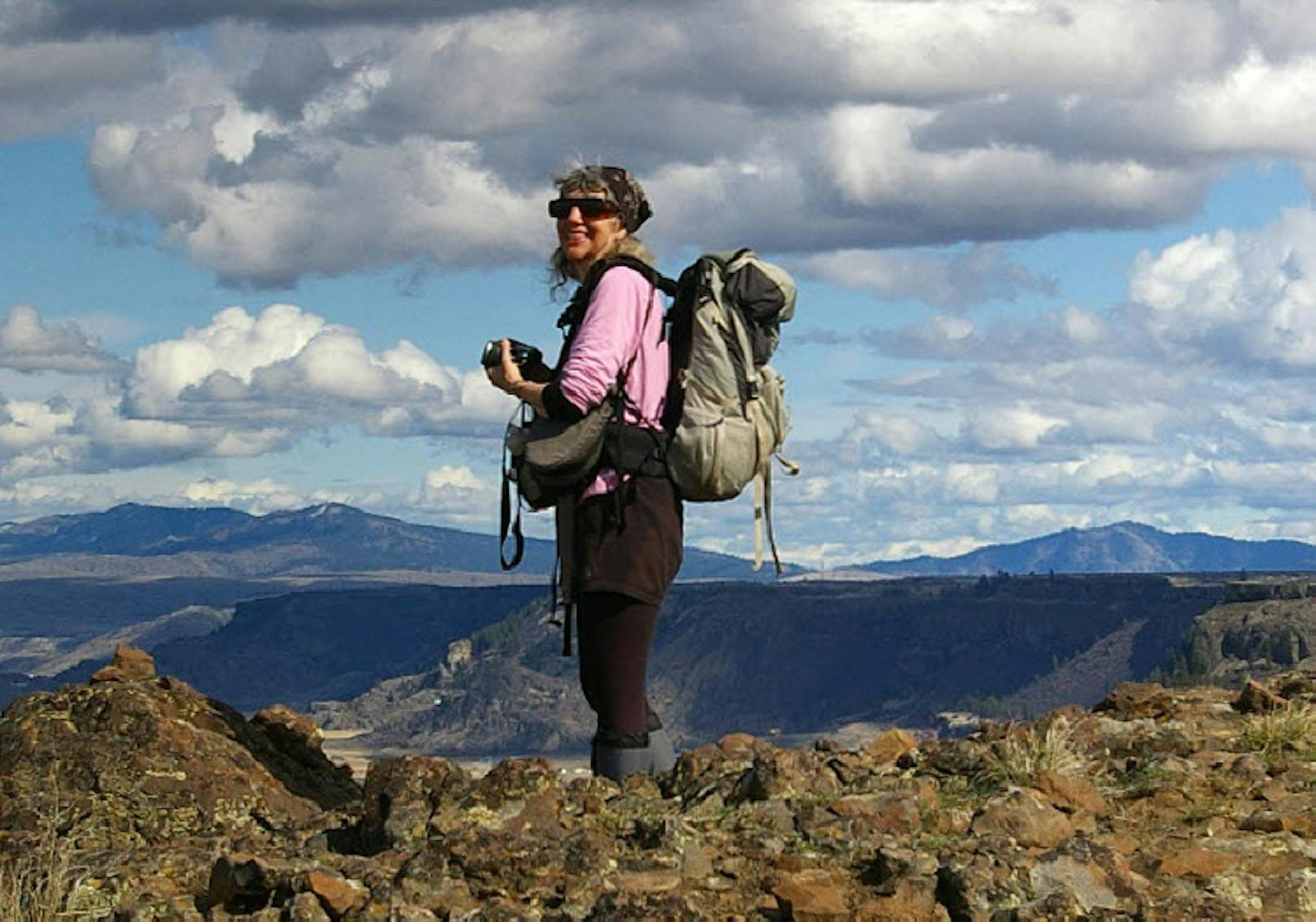 June 23, 2014: author and well-known hiker Karen Sykes stands at an overlook near Grand Coulee, Wash. Sykes, 70, who died of hypothermia in rugged terrain in Mount Rainier National Park over the weekend.
