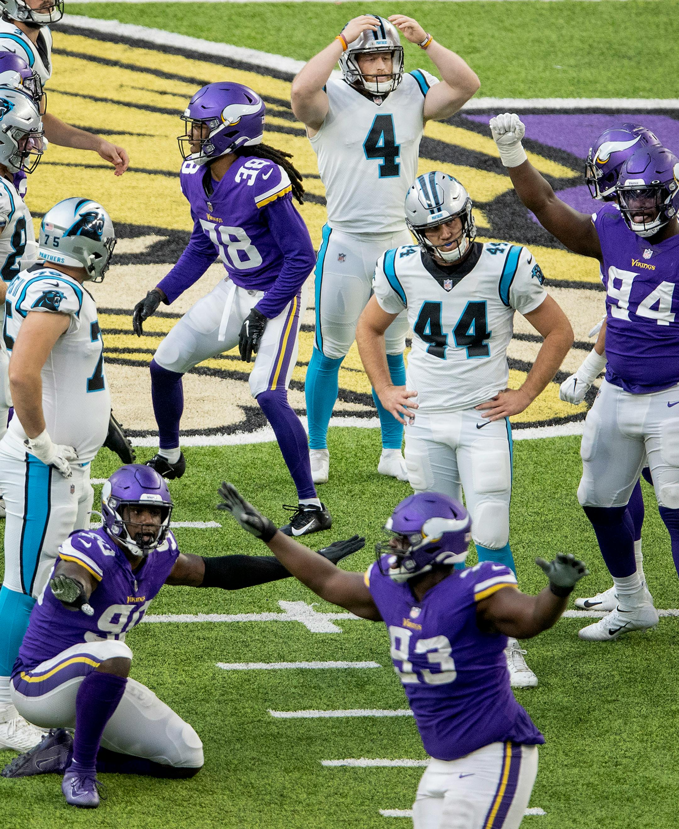 Minnesota Vikings players celebrated after Carolina Panthers kicker Joey Slye (4) missed a 54-yard field goal attempt.