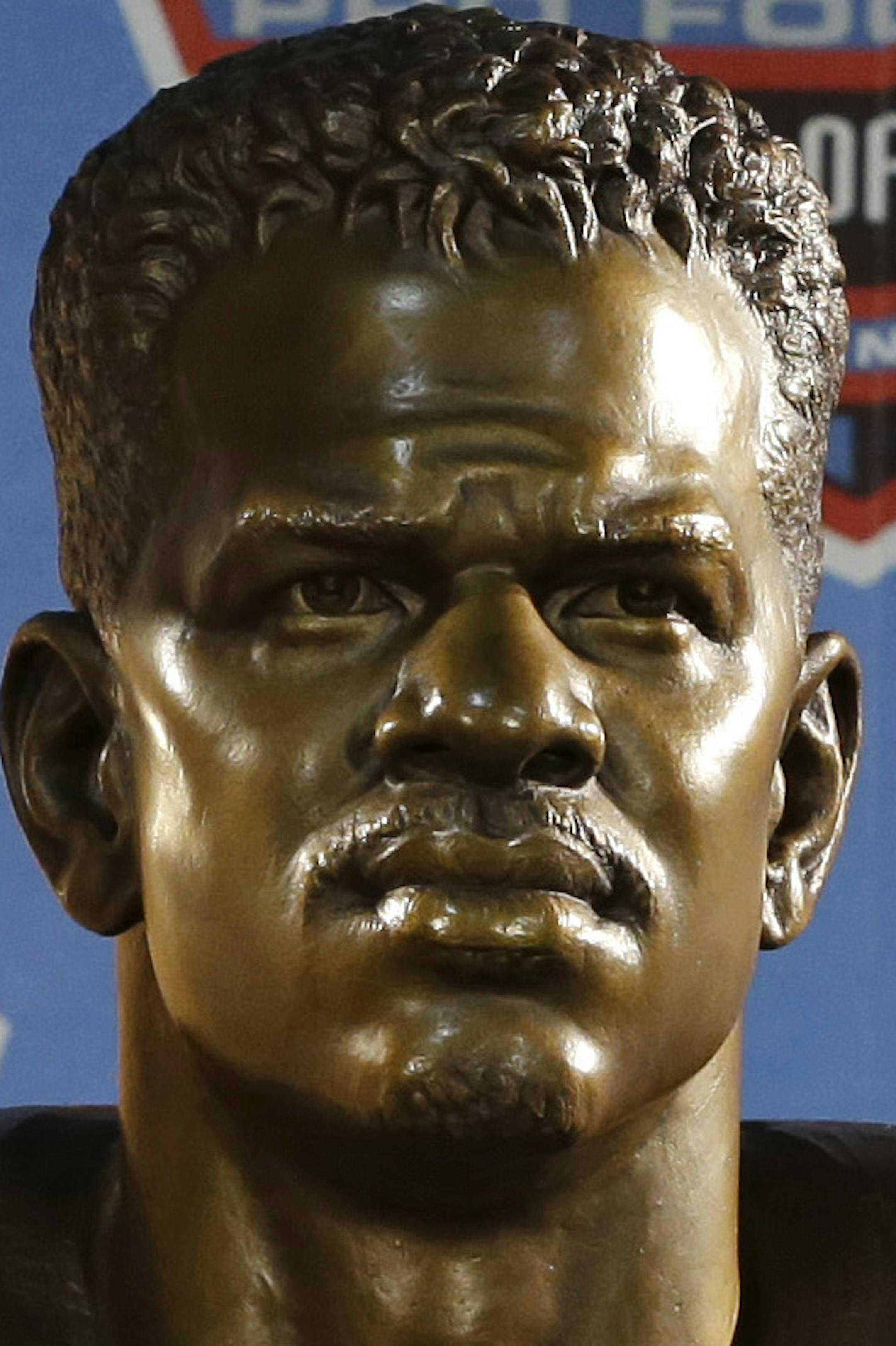 Hall of Fame inductee Andre Reed poses with his bust during the 2014 Pro Football Hall of Fame Enshrinement Ceremony at the Pro Football Hall of Fame Saturday, Aug. 2, 2014, in Canton, Ohio. (AP Photo/Tony Dejak)