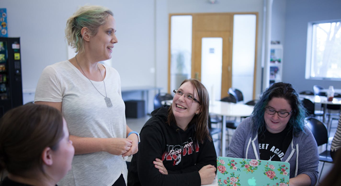 Sarah Olson, veteran software developer at The Nerdery, meets with colleagues and aspiring technologists at The Nerdery's Prime Academy training program for IT workers