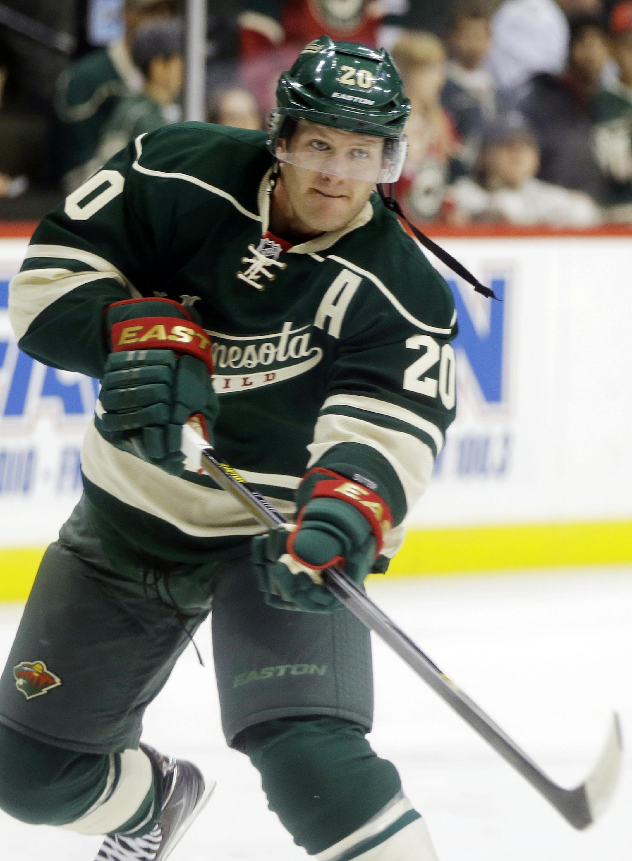 Minnesota Wild's Ryan Suter warms up prior to the first period of an NHL hockey game against the Los Angeles Kings, Thursday, Oct. 3, 2013, in St. Paul, Minn. (AP Photo/Jim Mone) ORG XMIT: MIN2013101616371273