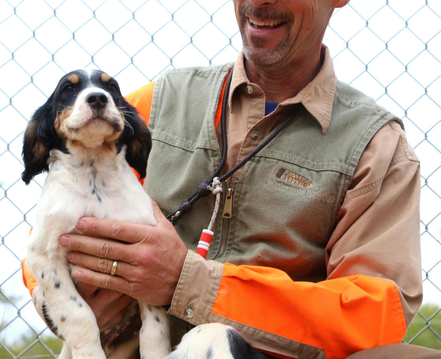 A cute English setter puppy brought yet another smile to Kolter. He co-owns Northwoods Bird Dogs with his wife, Betsy Danielson.