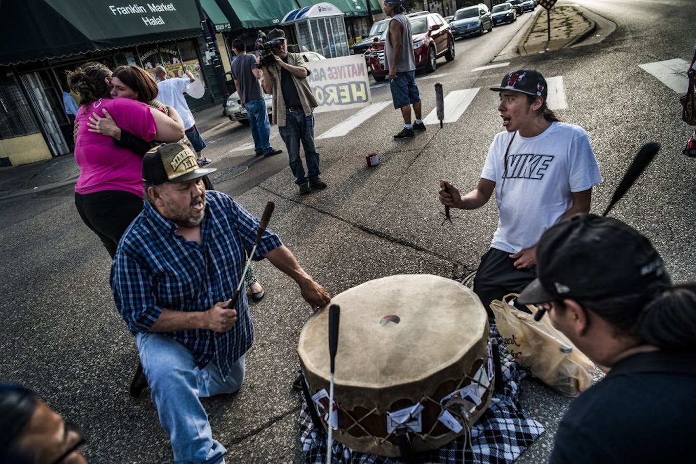 A drum circle and supporters of a vigil for William "Billy" Hughes blocked traffic at the intersection in front of the American Indian Center.