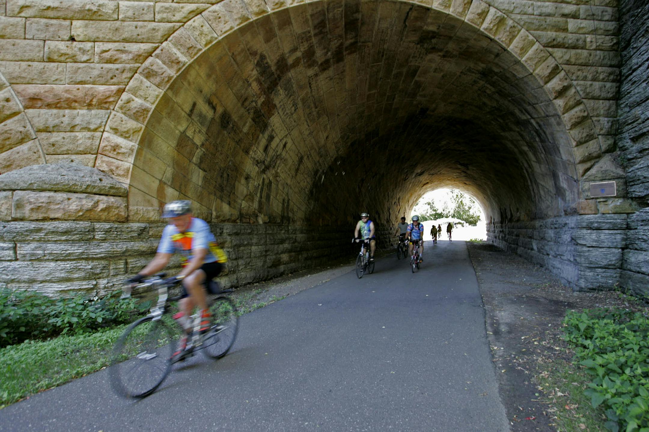 ELIZABETH FLORES • eflores@startribune.com ] August 7, 2008 - St. Paul, MN - Twin Cities Bicycle Club members made their way through a tunnel along their bike route on a hot morning on their way to Lake Phalen. The club is a "C" level ride, which is the most relaxed pace. Most of the members in the club are over 60-years-old and they make frequent stops to coffee shops.