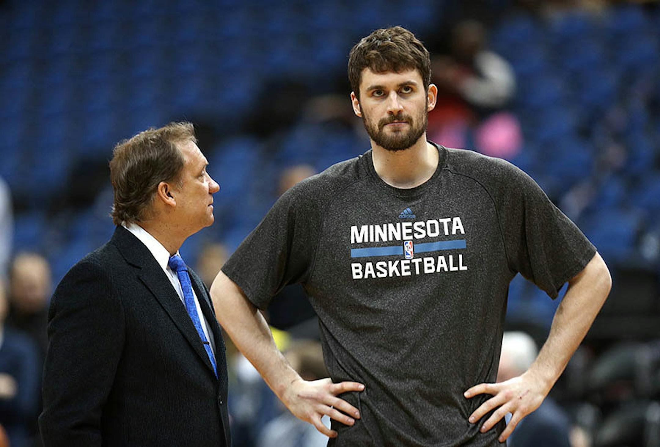 Timberwolves' Kevin Love talked with Flip Saunders before the game. Love did not play. Timberwolves played the Portland Trail Blazers at Target Center, Saturday, February 8, 2014.