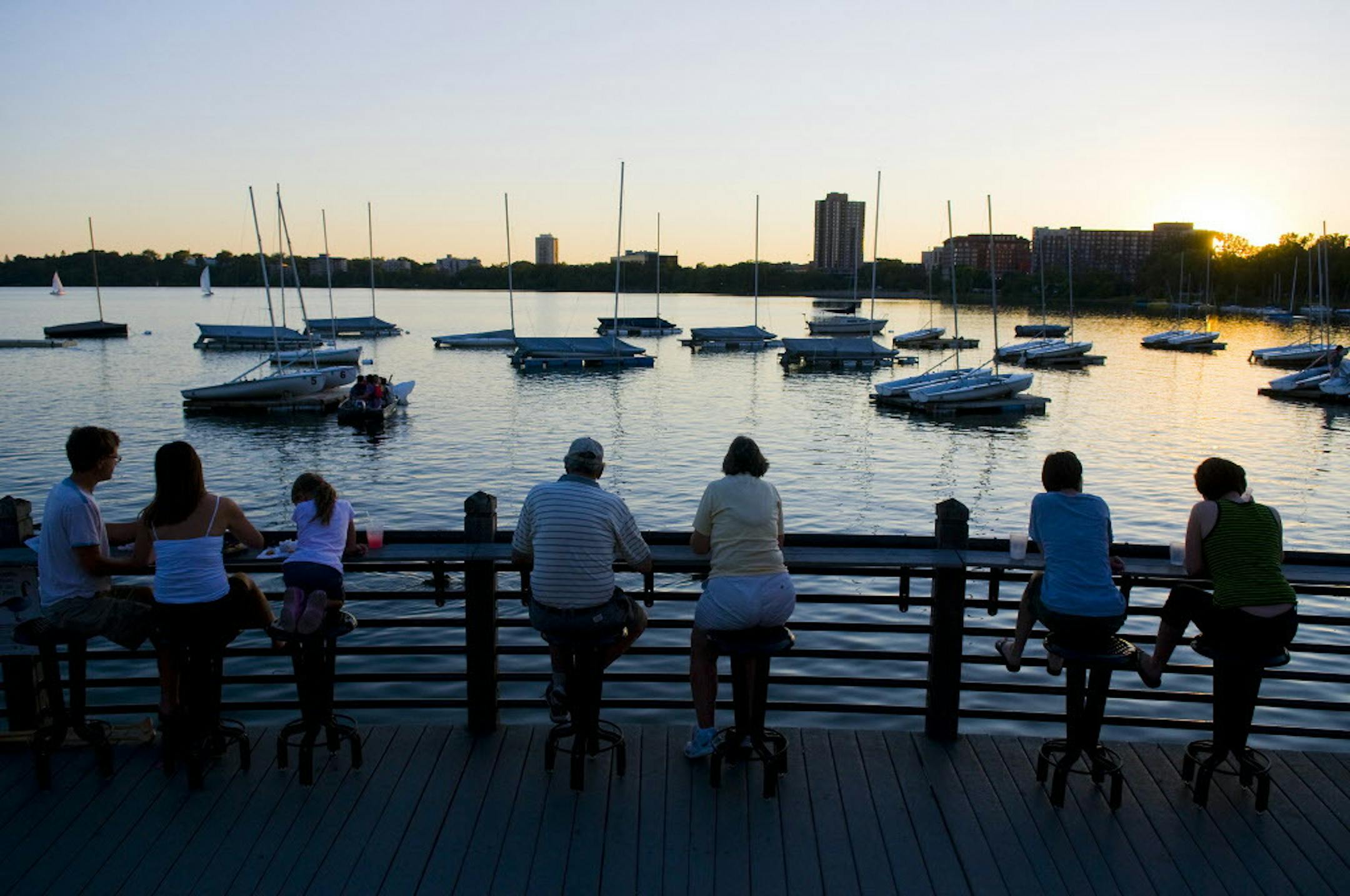 People overlooking Lake Calhoun as evening set in.