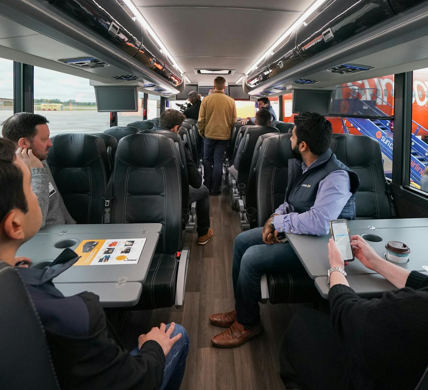 The interior of a Landline bus. Sun Country Airlines showed off its new design for the exterior of its planes, its new partnership with Landline and new headquarters built in a former hangar. ] GLEN STUBBE &#x2022; glen.stubbe@startribune.com Tuesday, October 15, 2019 Sun Country Airlines media day, to include Q&A with CEO jude bricker, update on its new technology system and partnership announcements. Visuals: tour of its new headquarters/office in a renovated airport hangar PLUS outdoor shots