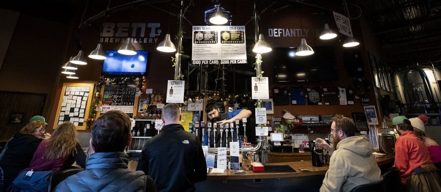 Colin Miller a manager at Bent Brewstillery poured a beer.