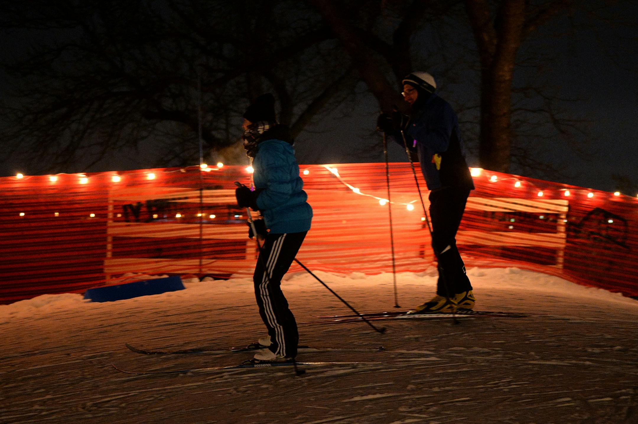 Skiers take a practice run along the trails near Lake Calhoun.