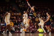 Caleb Williams (32) shot over former Gophers guard Elijah Hawkins (0) during an exhibition game in November. Williams scored 41 points against the Gop