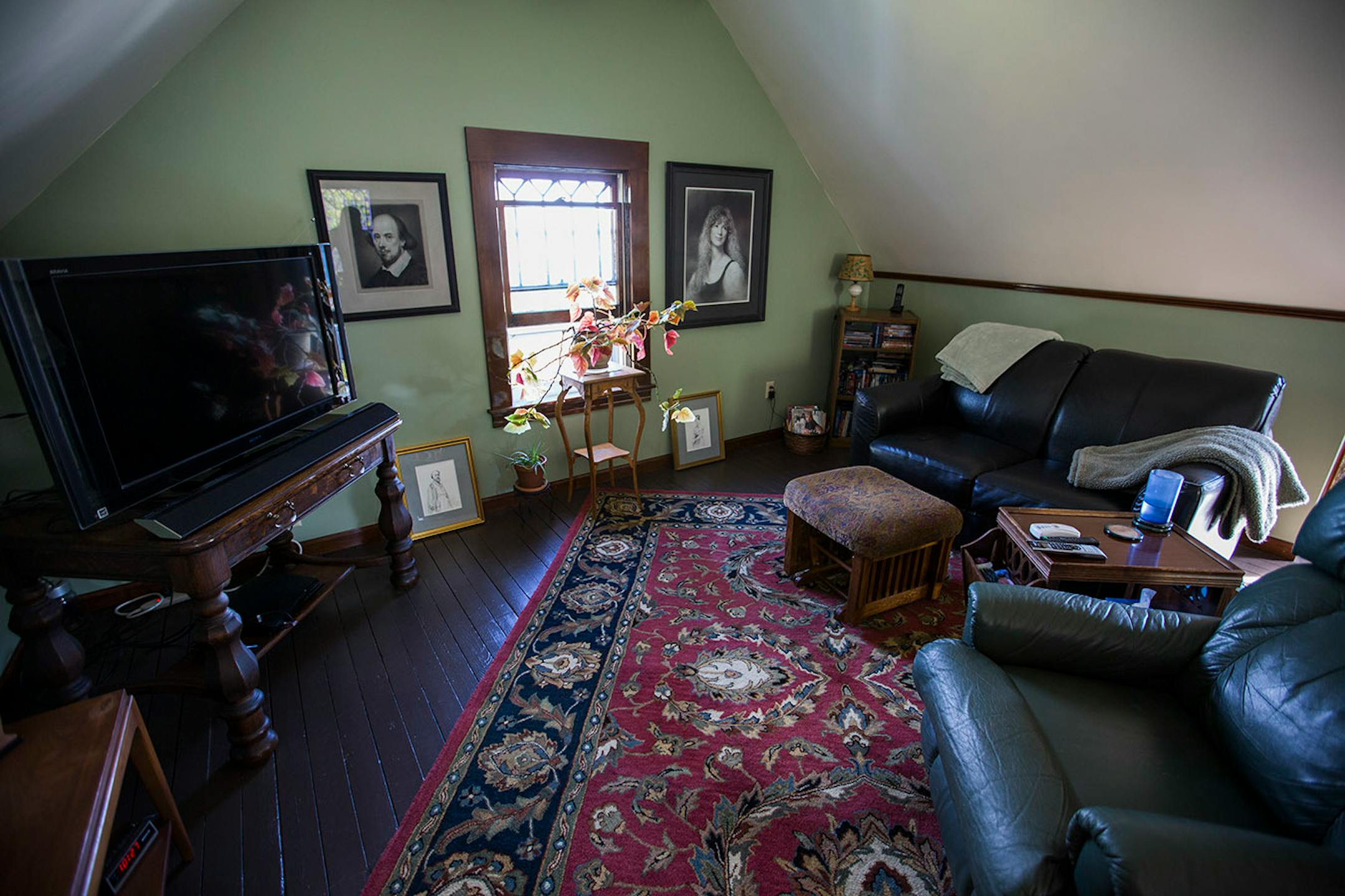 The 470-square-foot attic was transformed into an artists' studio on one side and a TV room on the other.
