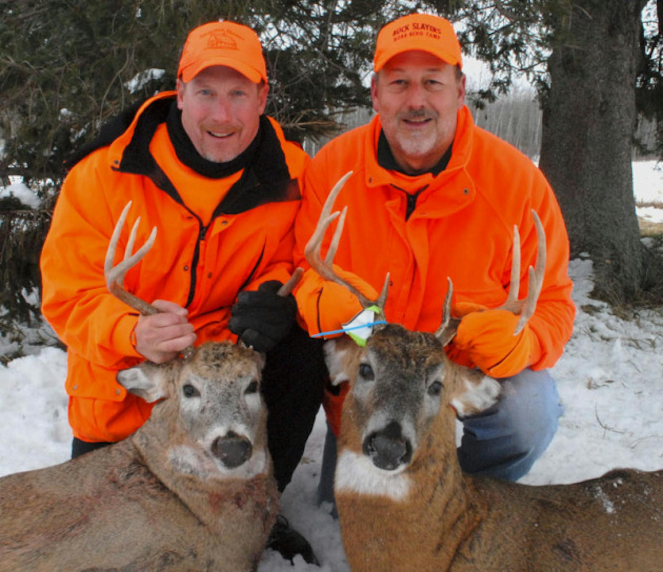 Rick Battis, left, and Tony Berg, right, both of the Twin Cities area, took these bucks north of Cumberland, Wis., on Saturday, first day of Wisconsin's nine-day firearms whitetail season. Hunting in the same general area, each shouldered his rifle at almost the same time: 8 a.m.